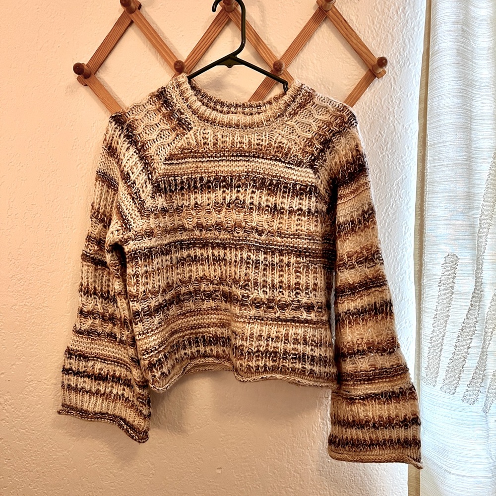 Cropped cable knit sweater